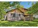 Backyard with weathered siding and wood deck at 11733 East 21St St, Indianapolis, IN 46229