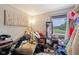 Cluttered bedroom filled with personal belongings, natural light and potential for personalization at 11733 East 21St St, Indianapolis, IN 46229