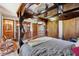 Detailed view of bedroom showcasing the four-poster bed, dresser, and en-suite bathroom at 11733 East 21St St, Indianapolis, IN 46229