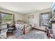 Bright bedroom with natural light, neutral walls, a decorative bed frame, and soft gray rugs at 11733 East 21St St, Indianapolis, IN 46229