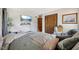 Cozy bedroom with a mounted TV, plush bedding, and closet space for organized storage at 11733 East 21St St, Indianapolis, IN 46229