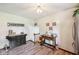 Charming dining area features farmhouse decor, wood laminate flooring, and a modern ceiling fan at 11733 East 21St St, Indianapolis, IN 46229