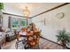Charming dining room with a wooden table and lots of natural light at 11733 East 21St St, Indianapolis, IN 46229