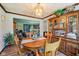 Warm dining room with wood accents, and open to the living room at 11733 East 21St St, Indianapolis, IN 46229
