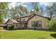 Attractive home with lush green lawn, mature trees, and pleasing curb appeal at 11733 East 21St St, Indianapolis, IN 46229