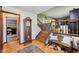 Open foyer area featuring wood floors, a staircase, and decorative accents at 11733 East 21St St, Indianapolis, IN 46229