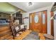 Welcoming foyer with wood floors, staircase, and elegant front door at 11733 East 21St St, Indianapolis, IN 46229