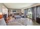 Cozy living room with plush sofa, accent table, and ample natural light at 11733 East 21St St, Indianapolis, IN 46229