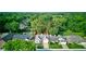 Aerial view of tree lined neighborhood with home featuring well maintained landscaping at 12258 Charing Cross Rd, Carmel, IN 46033