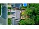 Overhead view of the home, highlighting the backyard, patio, and mature trees for outdoor living at 12258 Charing Cross Rd, Carmel, IN 46033