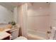 Bathroom showcasing a combined shower and tub, featuring light neutral tile and a modern vanity at 12258 Charing Cross Rd, Carmel, IN 46033
