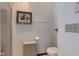 Bathroom featuring a toilet, neutral walls, and ample lighting at 12258 Charing Cross Rd, Carmel, IN 46033