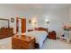 Bright bedroom features neutral carpet, complementary furniture, and art, offering a cozy retreat at 12258 Charing Cross Rd, Carmel, IN 46033