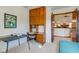 Bedroom with a wood built-in desk, offering a view into the living space from its doorway at 12258 Charing Cross Rd, Carmel, IN 46033