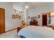 Bright bedroom features vaulted ceiling, art, rocking chair, and furniture, offering a cozy retreat at 12258 Charing Cross Rd, Carmel, IN 46033