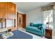 Bright bedroom with a daybed and a wooden built-in desk, creating a warm and inviting atmosphere at 12258 Charing Cross Rd, Carmel, IN 46033