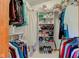 Organized walk-in closet features ample shelving, hanging space, and storage solutions at 12258 Charing Cross Rd, Carmel, IN 46033