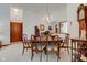 Traditional dining room featuring a round table, chairs, and decorative chandelier at 12258 Charing Cross Rd, Carmel, IN 46033