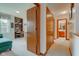 Bright hallway features neutral carpet and doors leading to rooms, with views of the bathroom and bedroom at 12258 Charing Cross Rd, Carmel, IN 46033