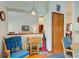 Bright kitchen nook featuring blue rocking chair and table, with nearby appliances and wood accents at 12258 Charing Cross Rd, Carmel, IN 46033