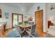 Cozy kitchen eating area near the sliding door, with wood floors and natural light at 12258 Charing Cross Rd, Carmel, IN 46033