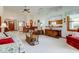 Open living room with dining area, wood trim, and cozy furnishings under vaulted ceilings at 12258 Charing Cross Rd, Carmel, IN 46033