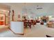 Open-concept living area with dining space, fireplace, and access to kitchen, perfect for entertaining at 12258 Charing Cross Rd, Carmel, IN 46033