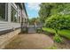 Backyard patio and landscaping features a brick patio and a small deck at 12563 Sandstone Run, Carmel, IN 46033