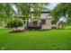 Large backyard with well-kept lawn and a partial view of the house at 12563 Sandstone Run, Carmel, IN 46033