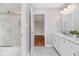 Bathroom featuring marble countertops, a sink, a toilet, and a shower-tub combination with a sliding glass door at 12563 Sandstone Run, Carmel, IN 46033