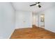 Bedroom with hardwood floors, closet, and an open doorway to the bathroom at 12563 Sandstone Run, Carmel, IN 46033