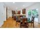 Kitchen with stainless appliances, island with granite countertops, and an adjacent dining area at 12563 Sandstone Run, Carmel, IN 46033