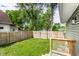 Private fenced backyard with a well-maintained lawn, perfect for outdoor relaxation and entertaining at 1342 N Oakland Ave, Indianapolis, IN 46201