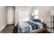 Bright bedroom featuring a large closet and a comfortable bed with blue patterned bedding for relaxation at 1342 N Oakland Ave, Indianapolis, IN 46201
