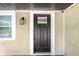 Elegant front door with glass details and craftsman style lantern at 1342 N Oakland Ave, Indianapolis, IN 46201