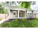 Charming bungalow with a covered front porch and fresh landscaping at 1342 N Oakland Ave, Indianapolis, IN 46201