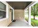 Charming front porch with lantern, front door and views of the neighborhood at 1342 N Oakland Ave, Indianapolis, IN 46201