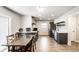 Bright kitchen with modern appliances, gray cabinets, and a spacious dining area perfect for Gathering meals and gatherings at 1342 N Oakland Ave, Indianapolis, IN 46201