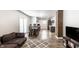 Open-concept living space with wood floors and sightlines into the kitchen at 1342 N Oakland Ave, Indianapolis, IN 46201
