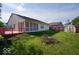 Expansive backyard features a wooden deck, enclosed sunroom, shed, and a well-maintained lawn at 1363 Briar Meadow Ct, Indianapolis, IN 46217