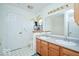 Well-lit bathroom with dual sink vanity, and white cabinets at 1363 Briar Meadow Ct, Indianapolis, IN 46217