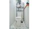 Clean bathroom featuring a toilet with shelves on top at 1363 Briar Meadow Ct, Indianapolis, IN 46217