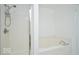 Clean bathroom featuring a tub with a shower next to a shower stall at 1363 Briar Meadow Ct, Indianapolis, IN 46217