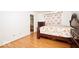 Cozy bedroom with hardwood floors and a view to an ensuite bathroom at 1363 Briar Meadow Ct, Indianapolis, IN 46217