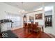 Elegant dining area featuring hardwood floors, a chandelier, and a view into the kitchen at 1363 Briar Meadow Ct, Indianapolis, IN 46217