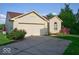 Charming single-story home featuring a brick facade, attached garage, and well-maintained landscaping at 1363 Briar Meadow Ct, Indianapolis, IN 46217