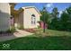 Inviting single-story home with a brick entrance, arched window, and colorful flower beds enhancing curb appeal at 1363 Briar Meadow Ct, Indianapolis, IN 46217