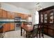 Functional kitchen and dining area with stainless steel appliances and a view into the dining room at 1363 Briar Meadow Ct, Indianapolis, IN 46217