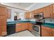 Charming kitchen with stainless steel appliances and view to a formal dining room at 1363 Briar Meadow Ct, Indianapolis, IN 46217
