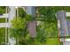 Overhead view of a well-maintained home surrounded by mature trees and lush landscaping at 1416 Miami S Ct, Plainfield, IN 46168